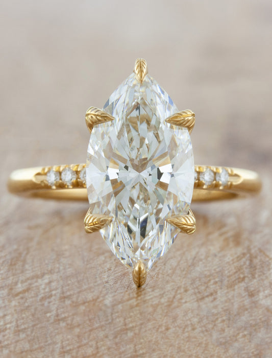 caption:Shown with 3.18ct marquise diamond in yellow gold