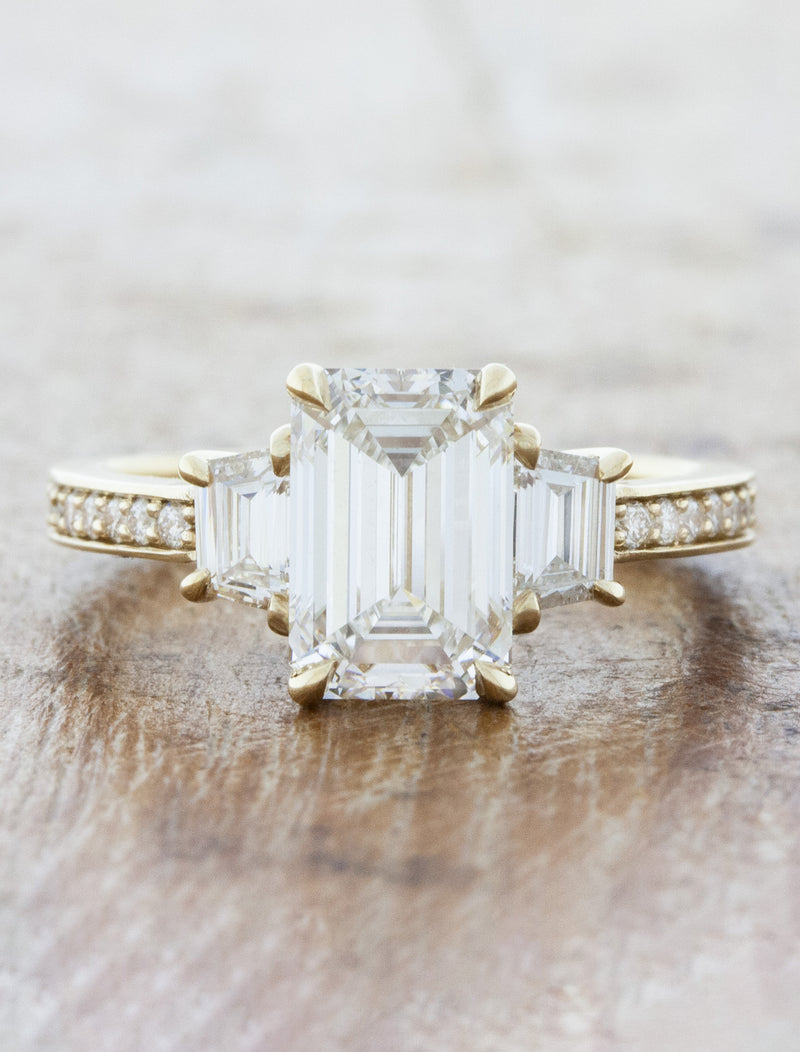 caption:Shown with 2.0ct emerald cut diamond in 14k yellow gold