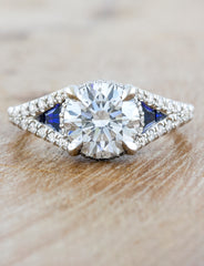 caption:Customized with round diamond and sapphire accents