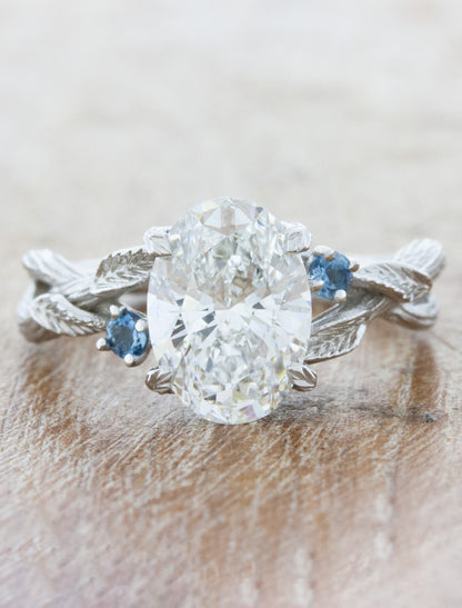 caption:2.50ct oval diamond w/ aquamarine accents