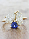 caption:Shown with 0.90ct marquise diamond, 1.40ct pear diamond, & 0.50ct trillion cut sapphire in 14k yellow gold