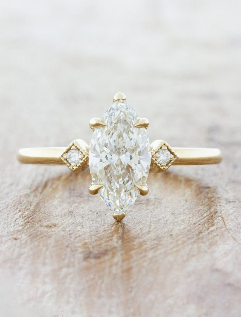 caption:Shown with 1.20ct marquise diamond in 14k yellow gold