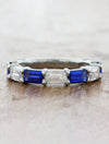 Caption:Customized with alternating blue sapphires in platinum