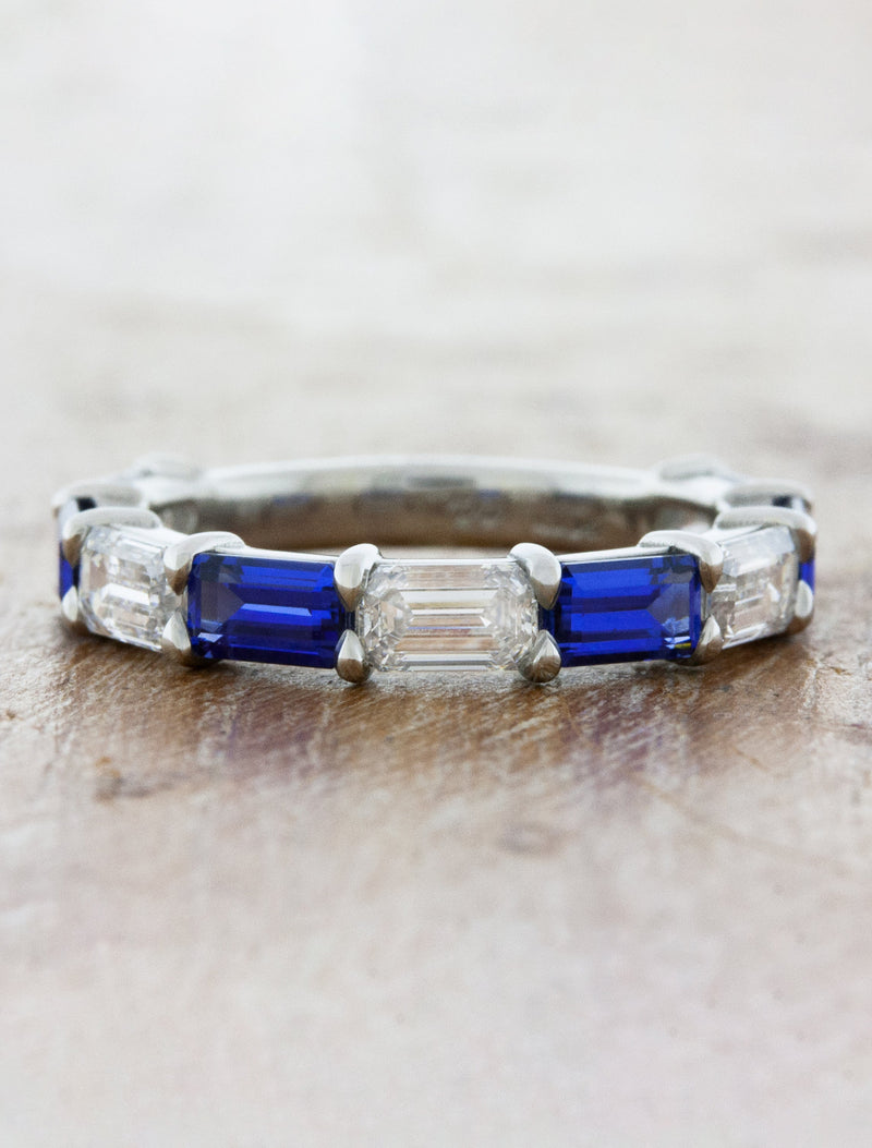 Caption:Customized with alternating blue sapphires in platinum