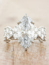 caption:Shown with 3ct marquise diamond in platinum