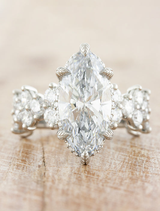 caption:Shown with 3ct marquise diamond in platinum