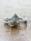 caption:Shown with 1.78ct salt & pepper pear diamond in platinum