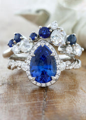 caption:Customized with a 2ct pear shaped sapphire and Vesabe wedding band