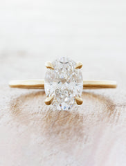 caption:1.50ct oval diamond in 14k yellow gold