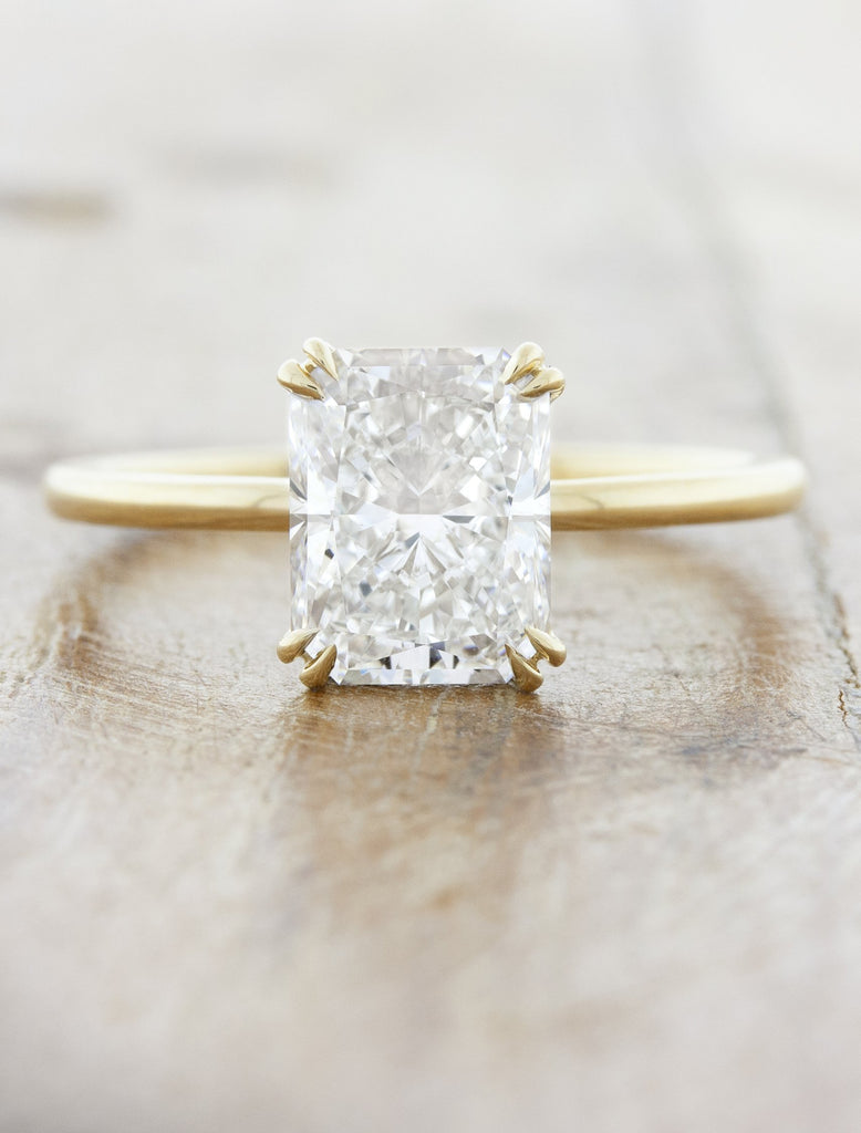 caption:Shown in 14k yellow gold option with 1.5ct center stone