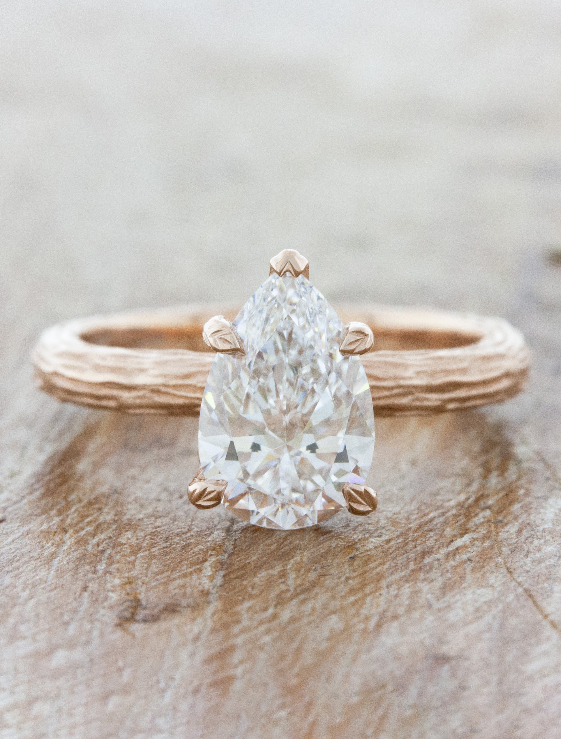 caption:Shown with 1.50ct pear diamond in 14k rose gold