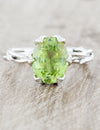caption:Customized with oval green sapphire & leaf prongs in platinum