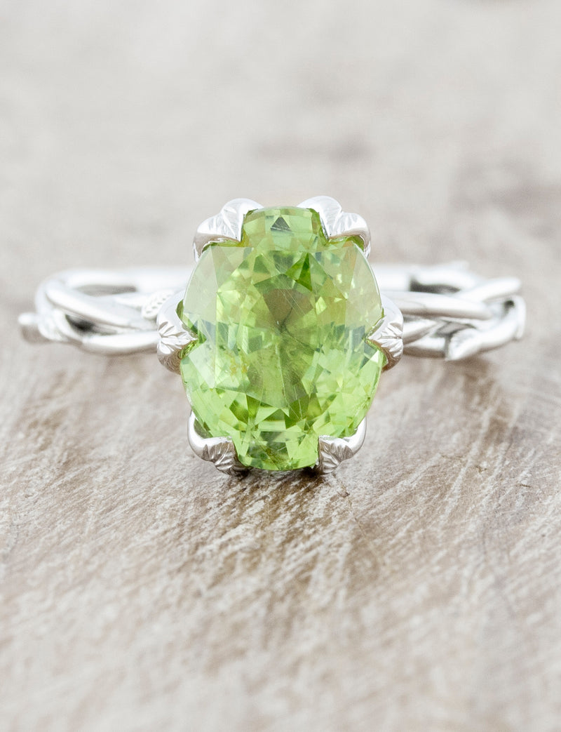 caption:Customized with oval green sapphire & leaf prongs in platinum