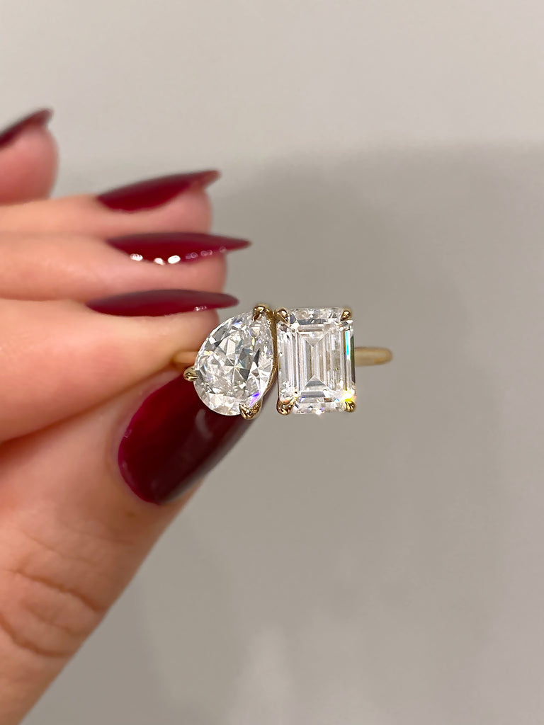 caption:Shown with a 1.20ct pear & 1.75ct emerald cut diamond in 14k yellow gold