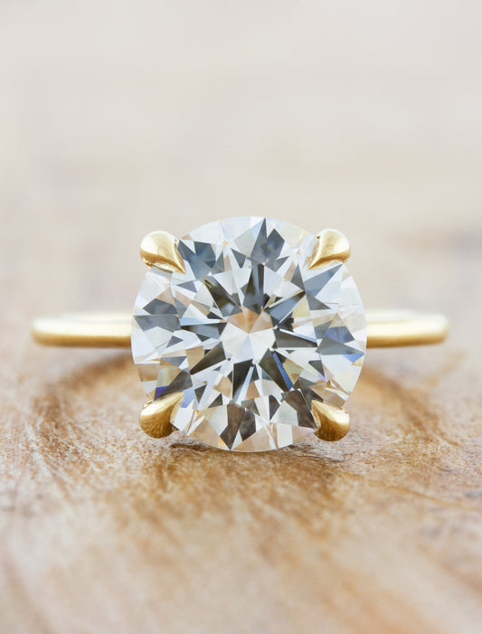 caption:Shown with 3ct round cut in 14k yellow gold 