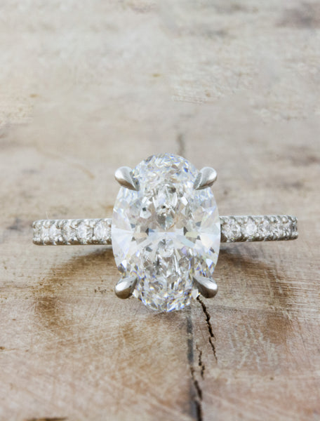 oval diamond engagement ring, pave band;caption:2.50ct. Oval Diamond Platinum