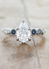 caption:Customized with 1.25ct pear diamond & sapphire side stones in platinum