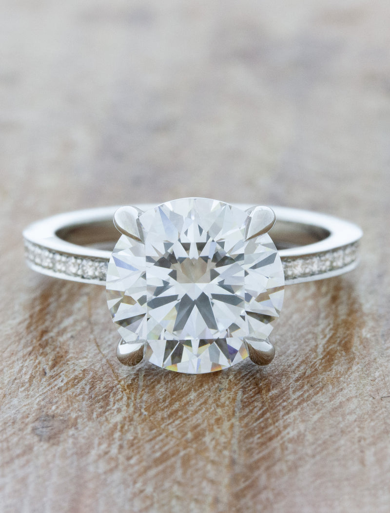 caption:Shown with 3.0ct round diamond in platinum