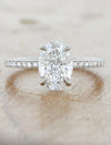 caption: Shown with 1.5ct center diamond in platinum