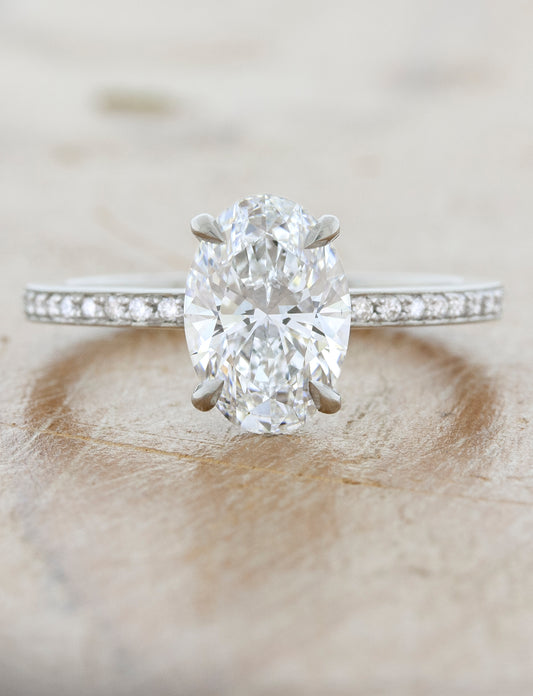 caption: Shown with 1.5ct center diamond in platinum