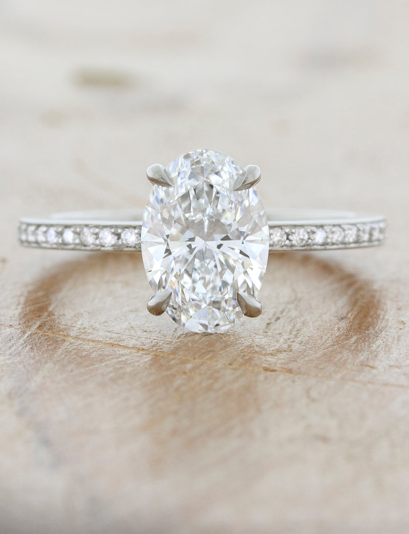 caption: Shown with 1.5ct center diamond in platinum