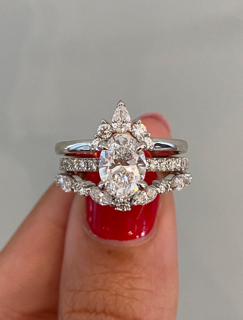 caption:Shown with Laxmie & Marquisa wedding bands in platinum