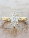caption:Shown with 1ct marquise diamond in 14k yellow gold