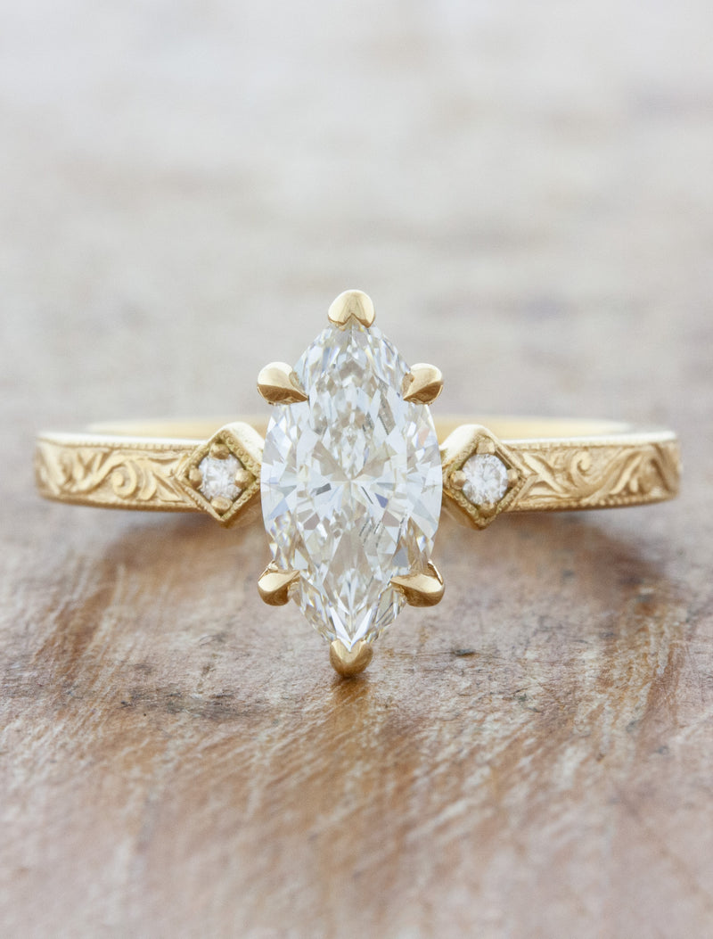 caption:Shown with 1ct marquise diamond in 14k yellow gold