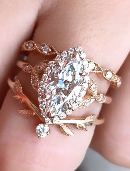caption:2.00ct. Marquise Diamond 14k Rose Gold paired with Lusia and Adelixa wedding bands
