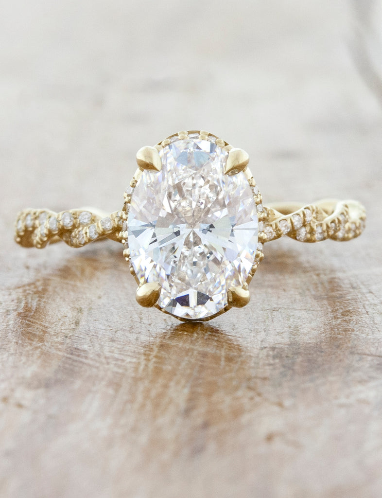 caption:Shown in 14k yellow gold with 1.7ct oval diamond option, customized with smooth prongs