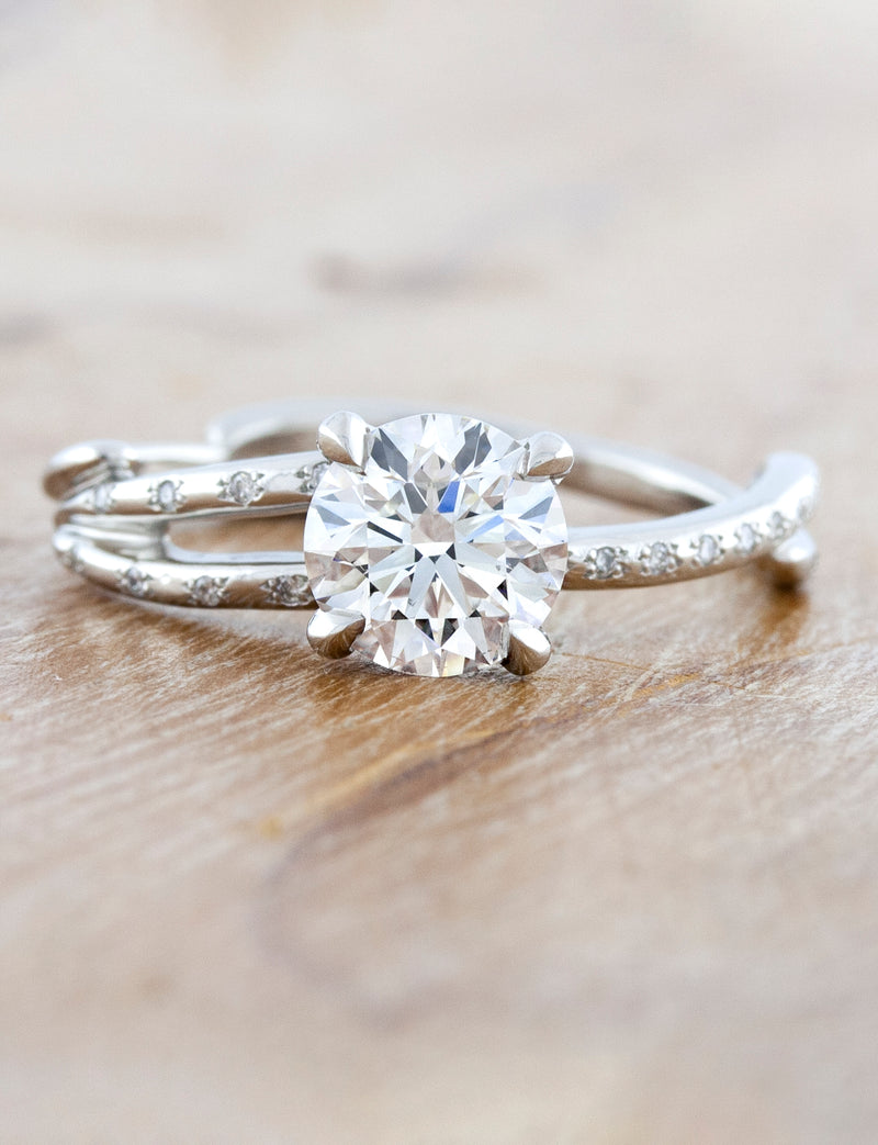 caption:Shown wit 1.21ct round diamond in platinum