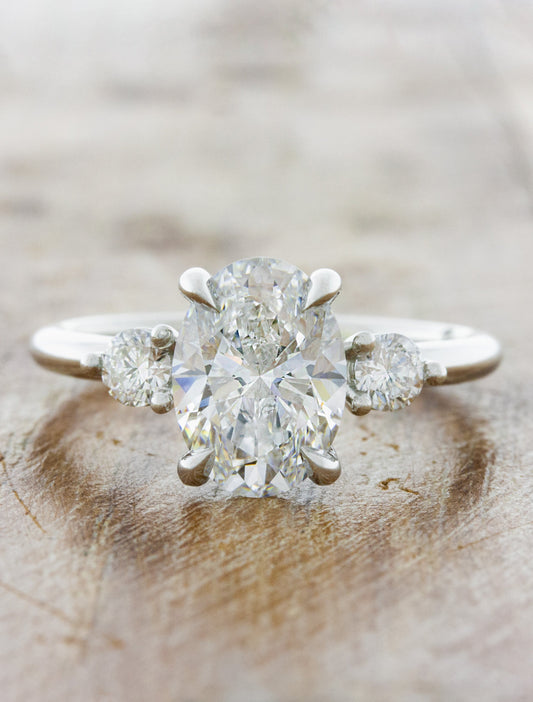 caption:Shown with 2.50ct oval diamond in platinum