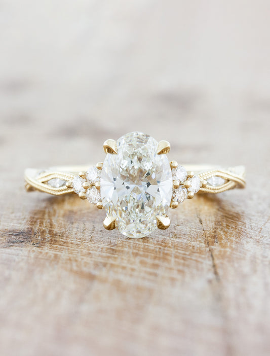 caption:Shown with 1.50ct oval diamond in 14k yellow gold
