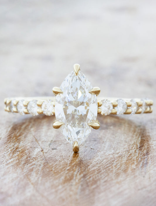 caption:Shown with 1.27ct marquise diamond in 14k yellow gold