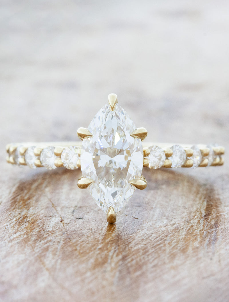 caption:Shown with 1.27ct marquise diamond in 14k yellow gold