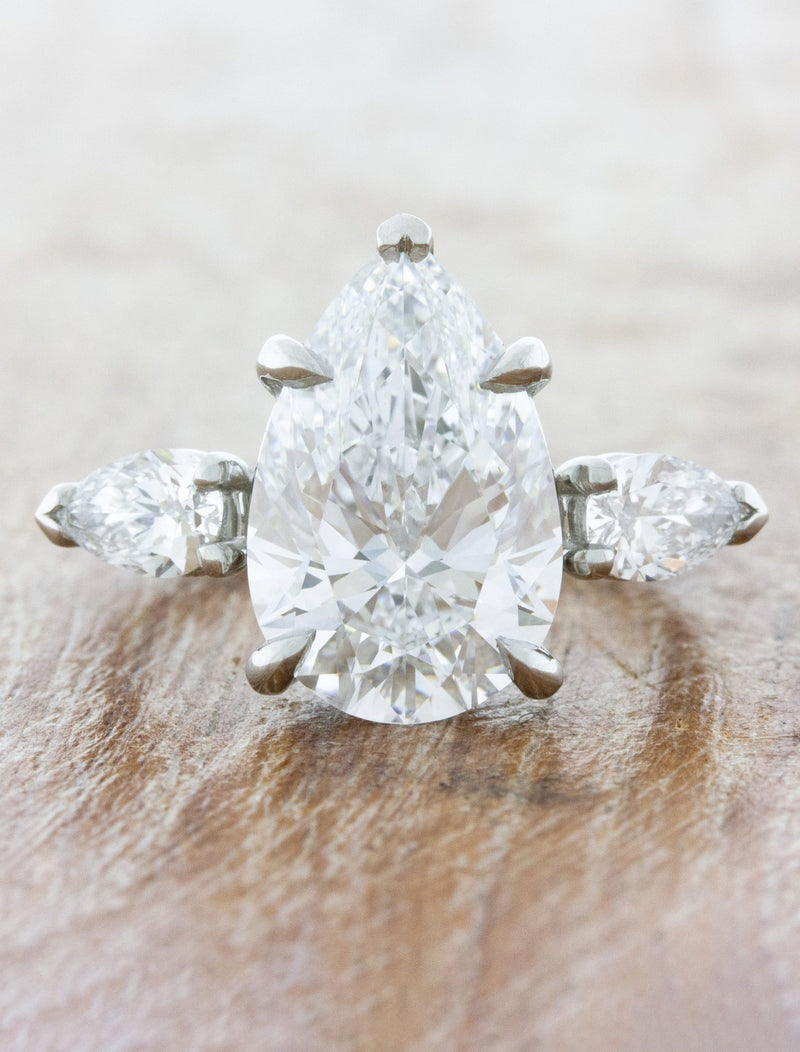 caption:Shown with 3.70ct pear diamond in platinum