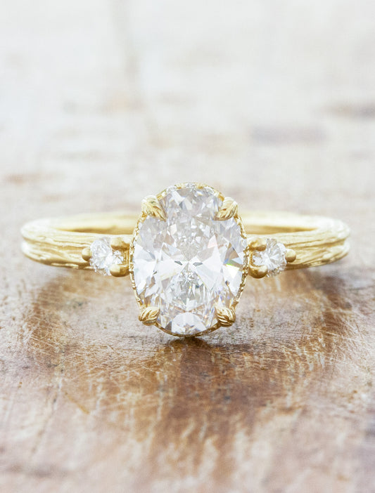 caption:Shown with 1.50ct oval diamond in 14k yellow gold