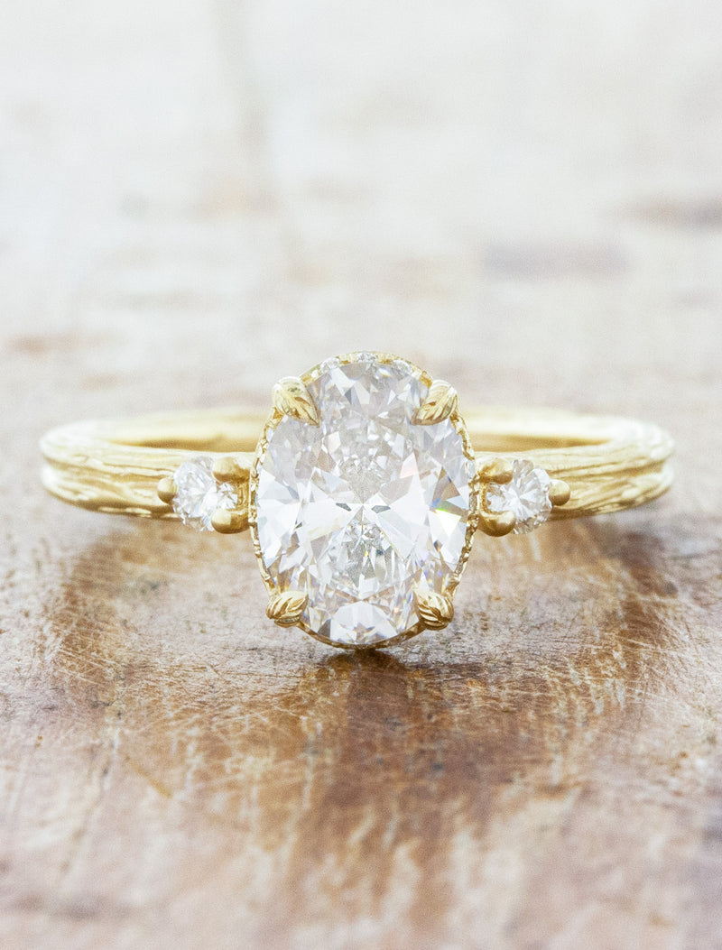 caption:Shown with 1.50ct oval diamond in 14k yellow gold