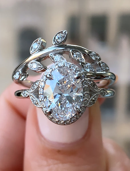 Matching oval halo engagement ring with wedding band
