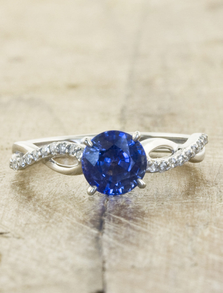 caption:Shown with round sapphire in 14k white gold