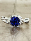 caption:Customized with round blue sapphire in platinum