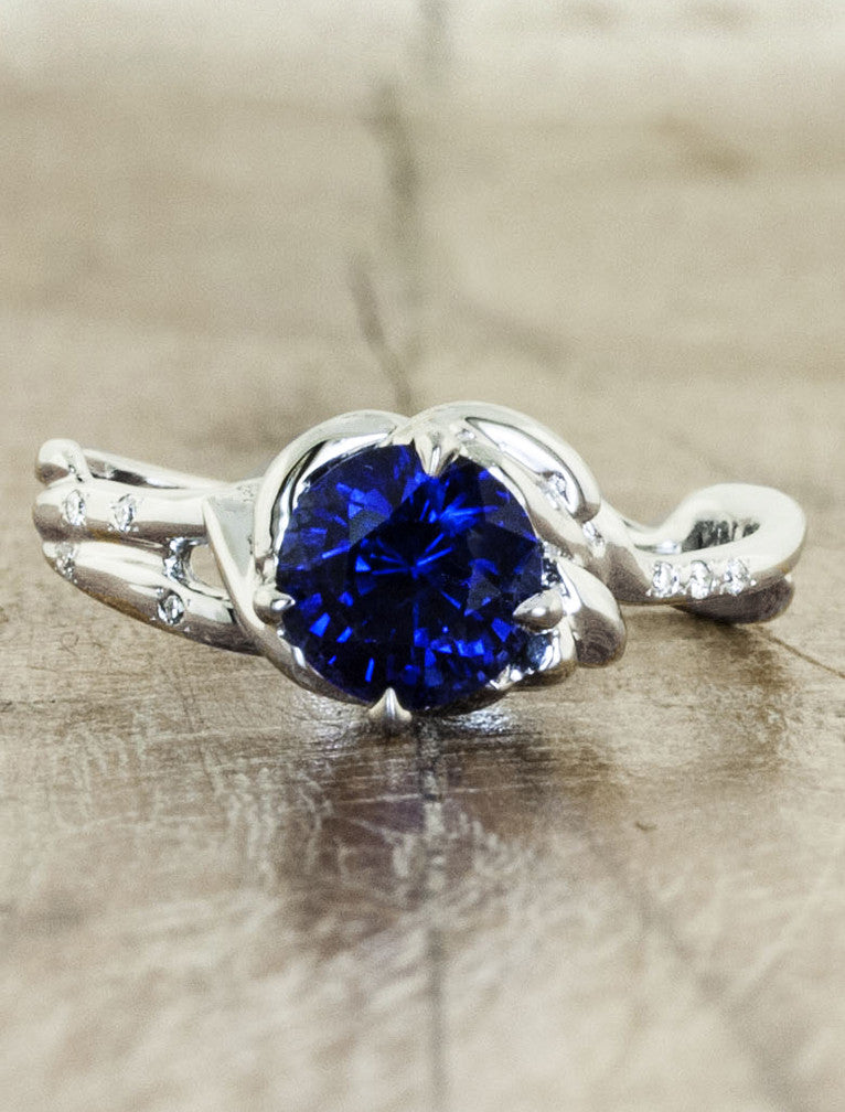 caption:Customized with round blue sapphire in platinum
