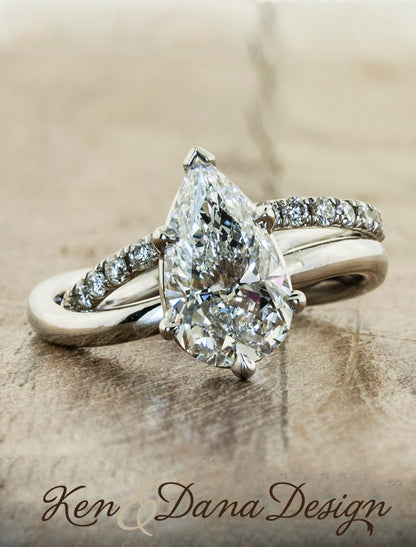 pear shaped diamond ring wave band;caption:2.09ct. Pear Diamond Platinum paired with Bella wedding band