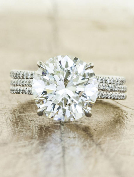caption:Shown with a 3ct round diamond, paired with Bella wedding band