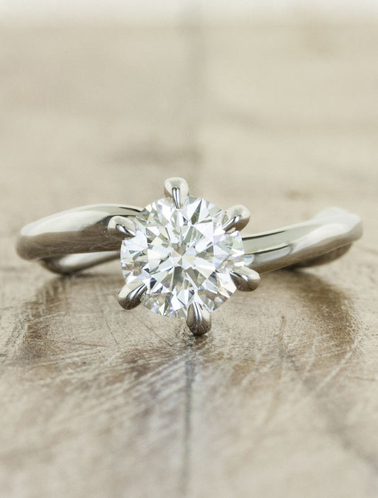caption:Shown with 1.00ct round diamond in platinum
