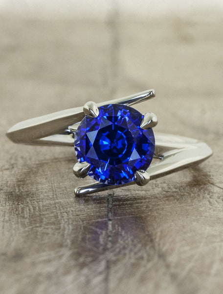unique sapphire engagement ring, asymmetrical band.  caption:Customized with an 1.75ct. Round Sapphire, 14k White Gold