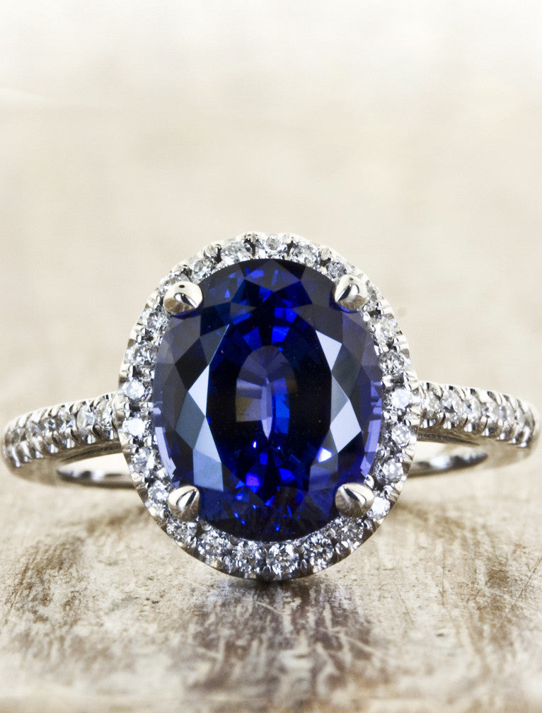 caption:Shown with 3.68ct oval blue sapphire in platinum