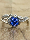 caption:Shown with round blue sapphire in 14k white gold