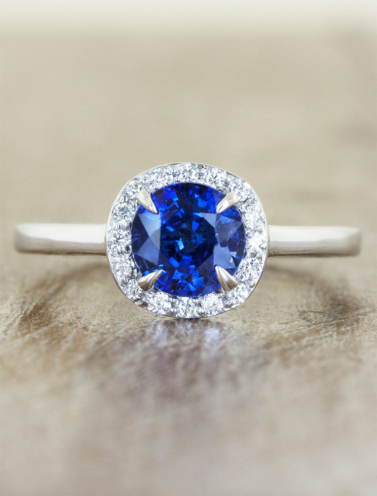 halo sapphire engagement ring, plain band. caption:Customized with a blue sapphire center stone