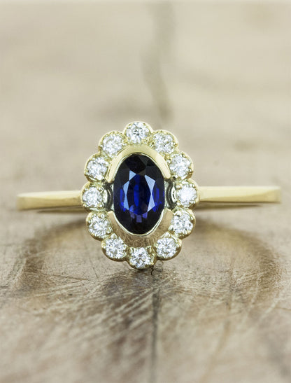 delicate halo, oval sapphire engagement ring